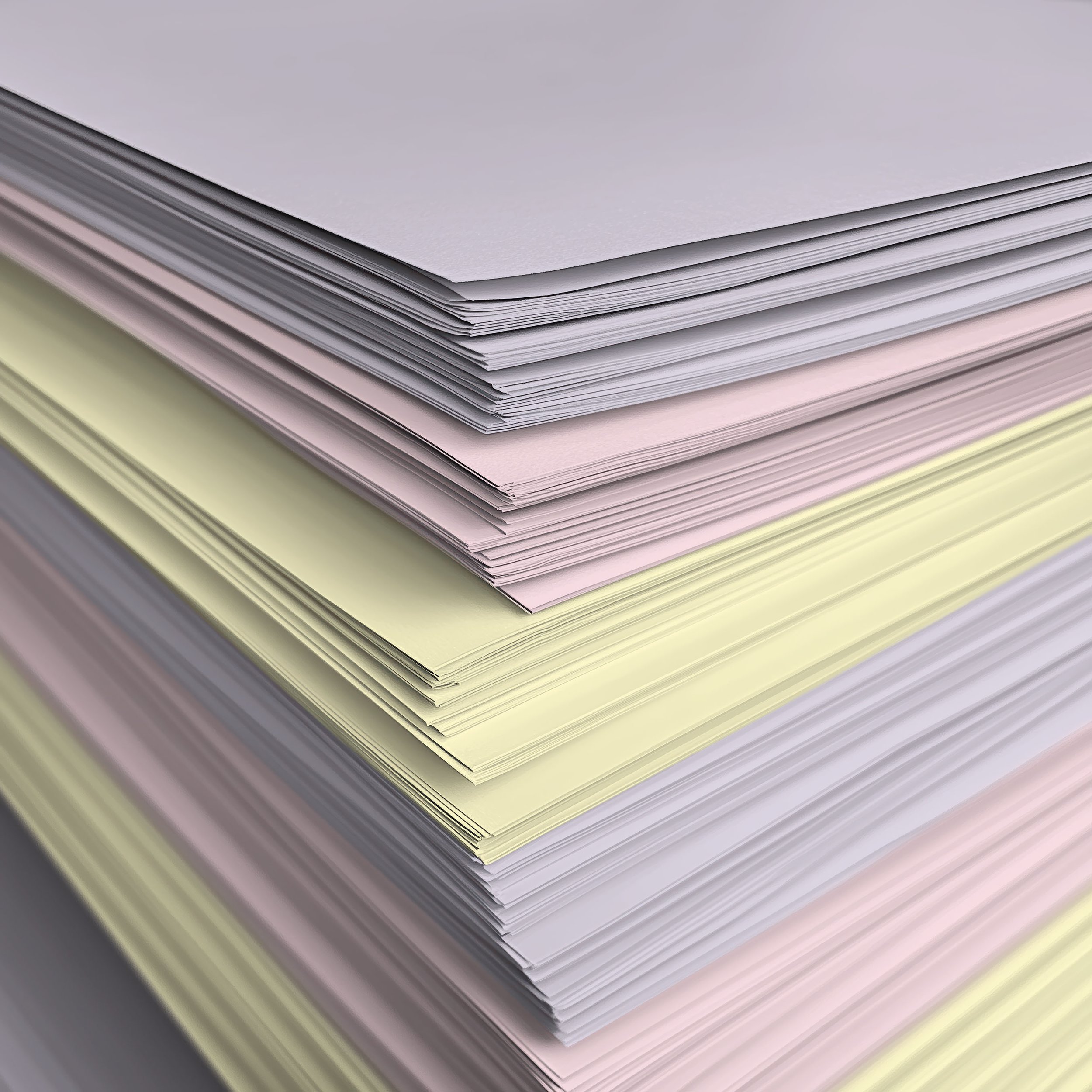 Stack of pastel-coloured paper stock samples